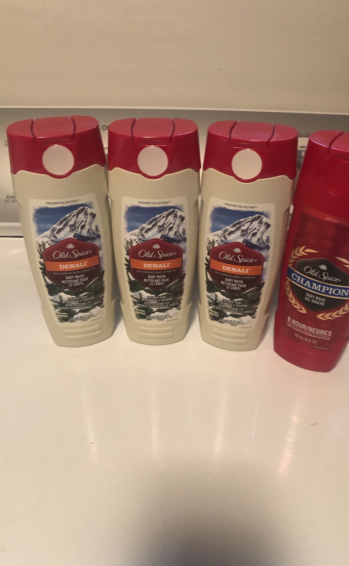 4 Bottles of Old Spice Body Wash. please see all the pictures