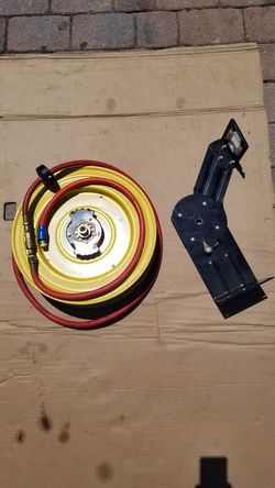Air hose reel and mounting bracket.