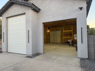 Garage doors installed and fully functional. New hardware springs etc