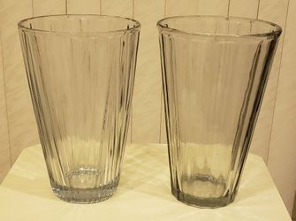 Two large clear vases 10" tall