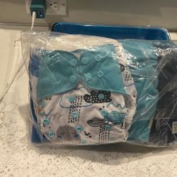 Cloth diapers with liners. Super cute.