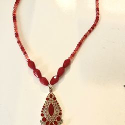 Handmade necklace with glass beads, and a pendant