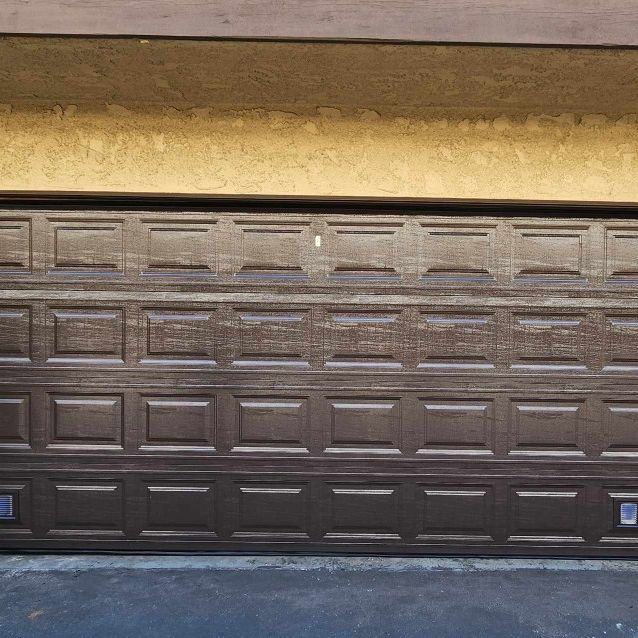 Brown Garage Door With Bottom Vents