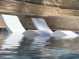 Pool lounge chairs  in pool