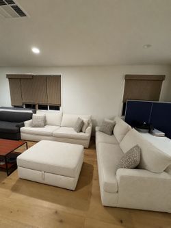 Two Living Spaces couches with storage ottoman
