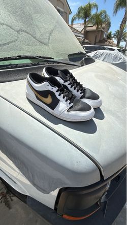 Black gold and white Nikes