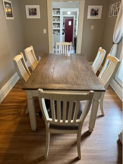 Six person Ashley dining room table set