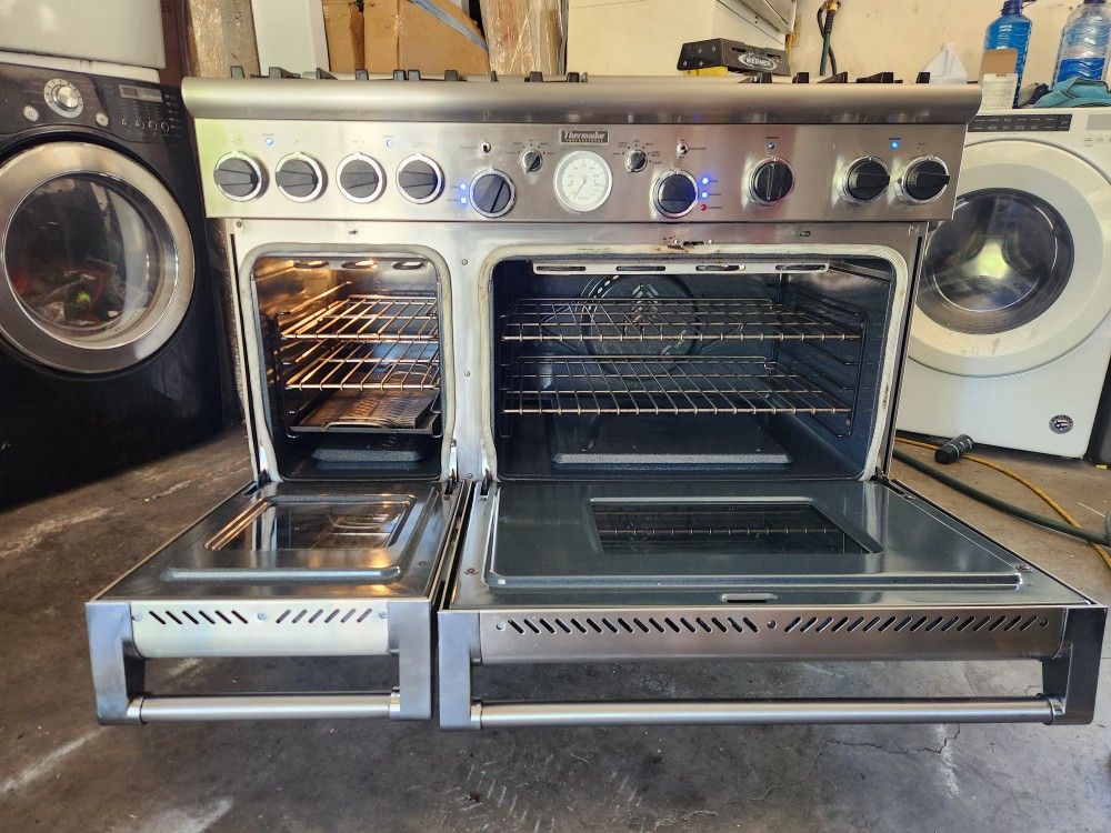 A 48" wide Thermador stove is in good condition, it is 2 20" with gas.