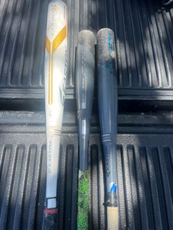 Softball and 1 baseball bat