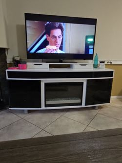 TV stand with warming artificial fireplace and hideaway speaker system