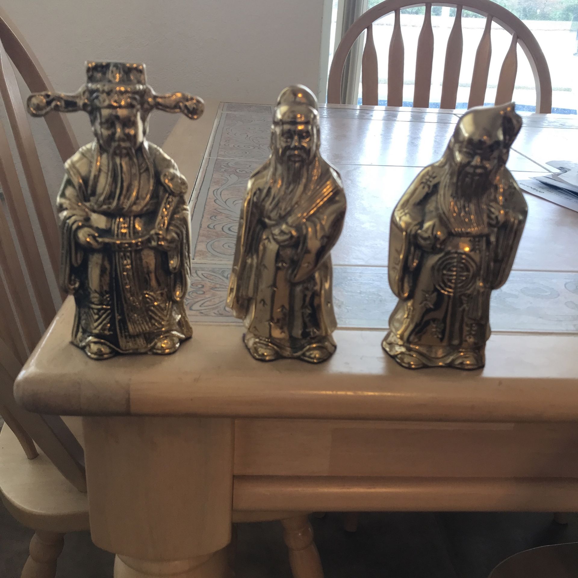 Three Brass Statues