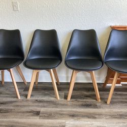 4 Black And Wood Dining Chairs 
