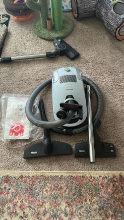 Miele Vacuum, all attachments, plus bags.