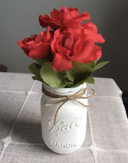 Distressed mason jar vase with silk flowers