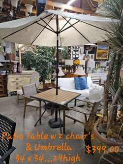 Patio Table w2 chair's w/ Umbrella We are located at 2811 East Bell road. Another Time Around Furniture.