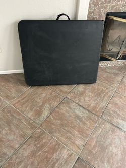 6 ft table ( folds in two, has a carrying handle)