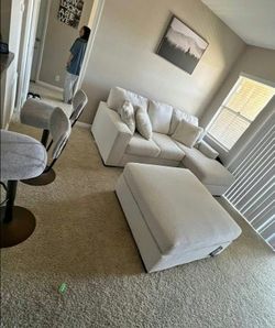 Light Gray Sofa with Ottoman and Pillows