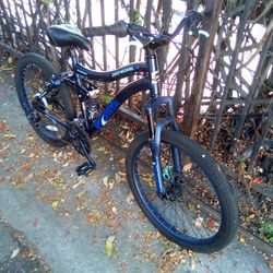Boys 24 Genesis full suspension mountain bike with front disc brake