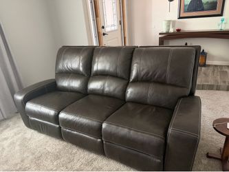 Power reclining leather sofa