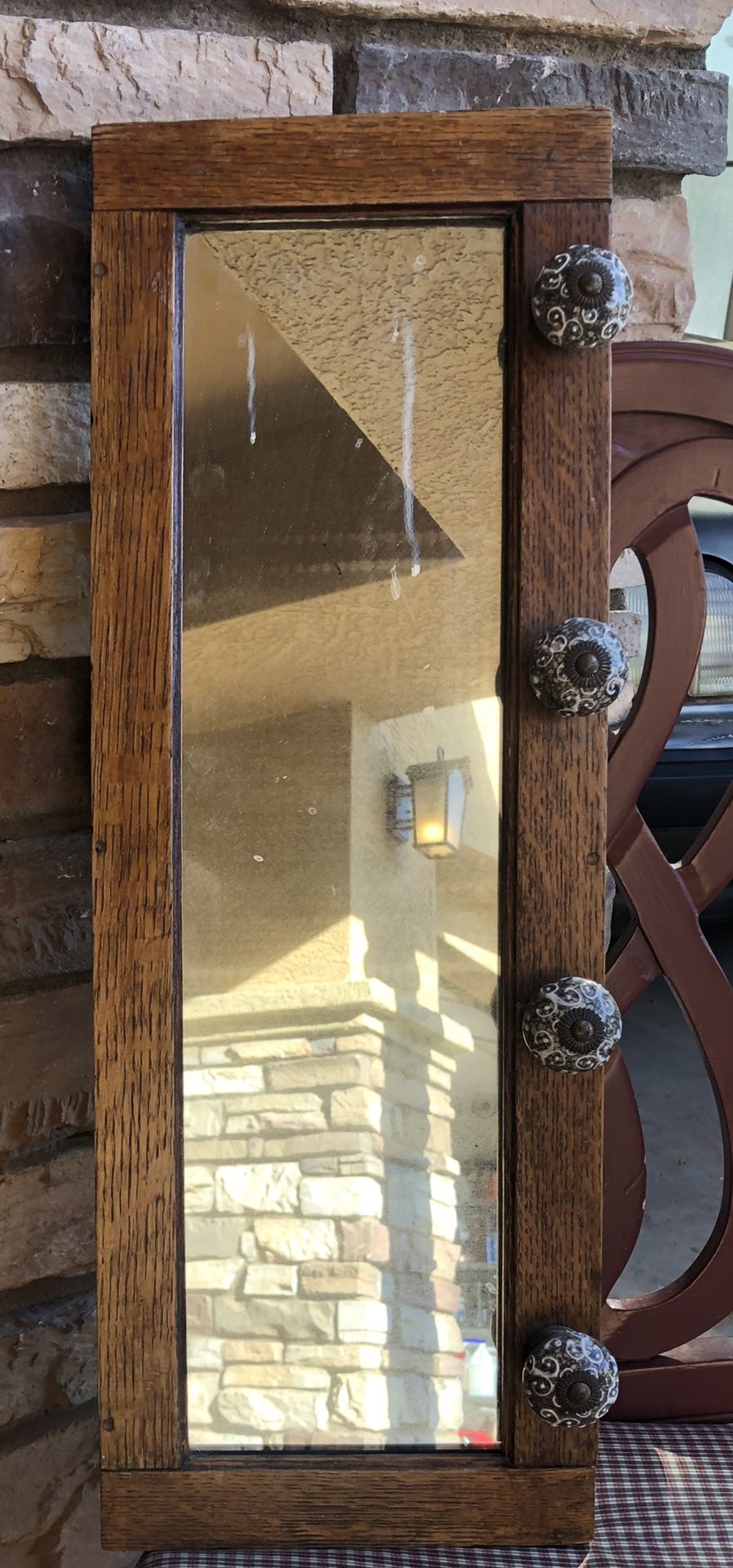 Antique oak frame mirror with knobs hooks