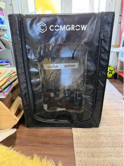 Small grow tent with hydroponics machine and light