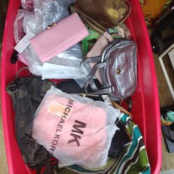 HUGE CONTAINER OF BRAND NAME NEW PURSES AND WALLETS
