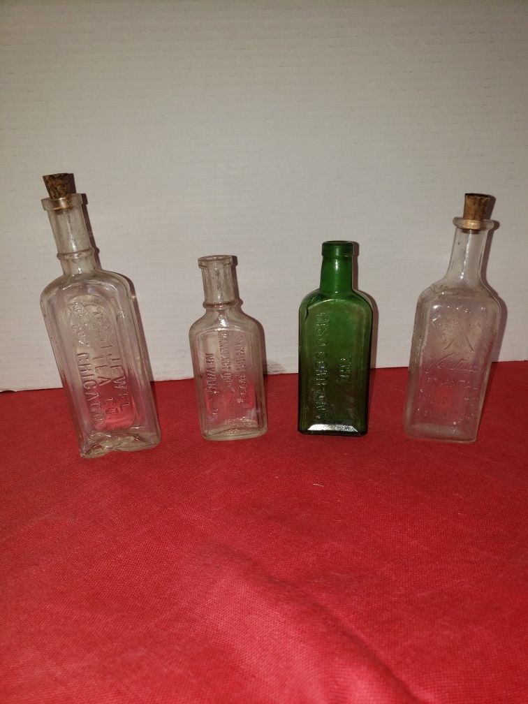 4 antique bottles (READ DESCRIPTION & SEE ALL PICTURES) $12.99 for the 3 that's left