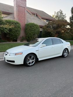 Acura TL White Sedan with Chrome Wheels