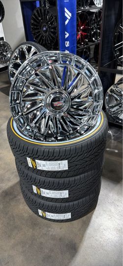 20s with floating Cadillac caps new 5x120 with tires
