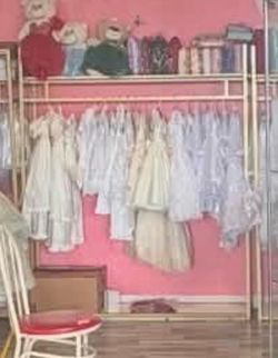 Heavy-duty gold clothing rack with shelves, freestanding gold metal garment rack for retail display (59 inches long)