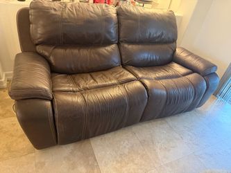 Brown leather couch, very comfortable, steel frame electric reclining