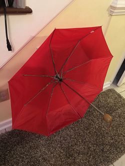 Brand new red umbrella
