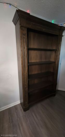 Tall Dark Wood Bookcase with Crown Molding