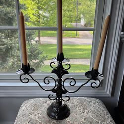 Iron Candelabra in Excellent Condition Antique Bronze in color. Measures 18” x 14”. Smoke and pet free household.