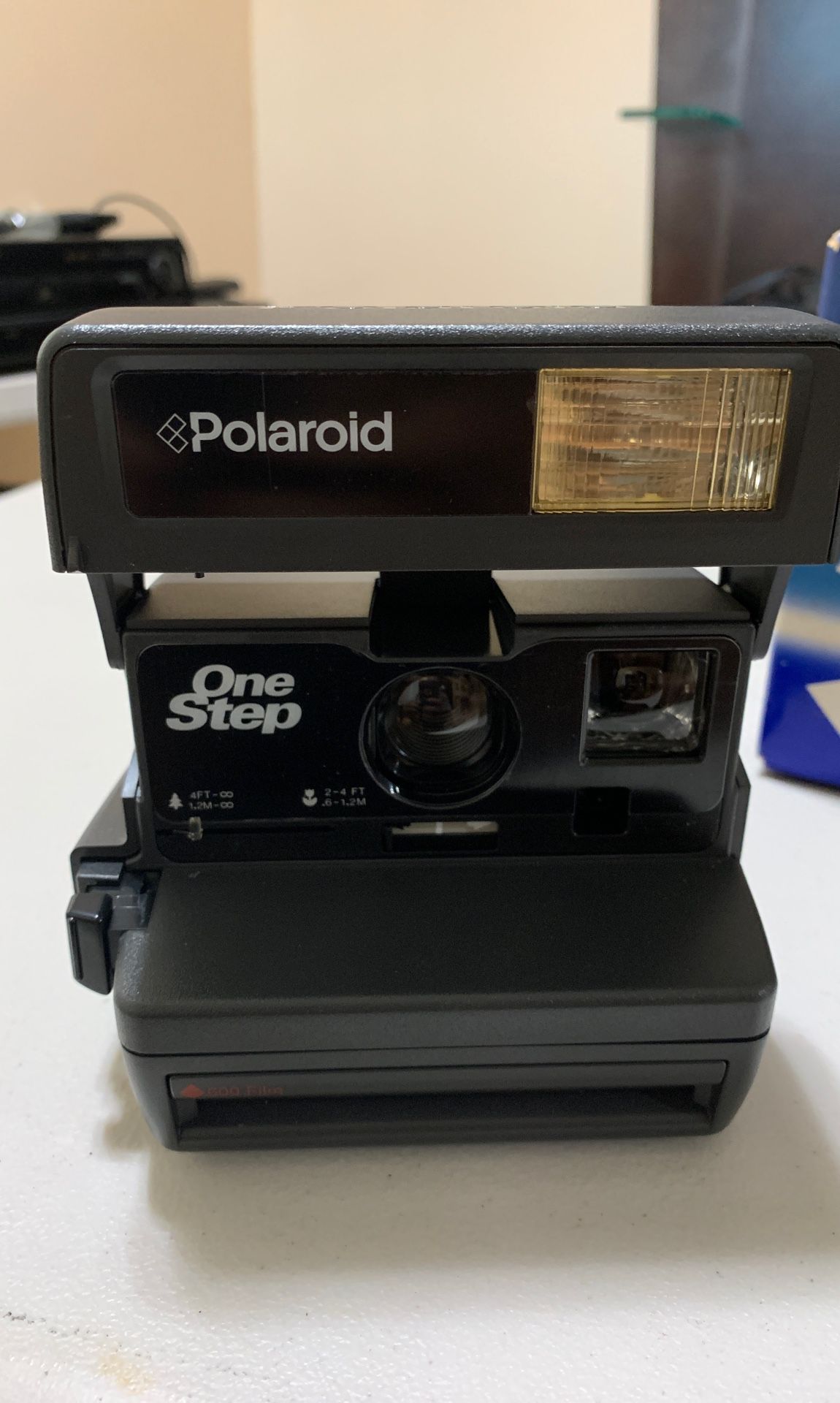 Vintage Polaroid One Step Close Up Flash Camera with strap.