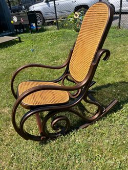 Thonet Bentwood Rocking Chair With Hand Caned Seat Has minor Knick on 1 arm as shown