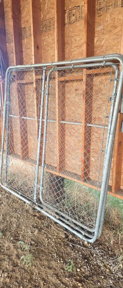 2 chain link panels, one w gate
