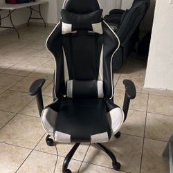 Gaming Chair With Head Rest And Lay Back Features 