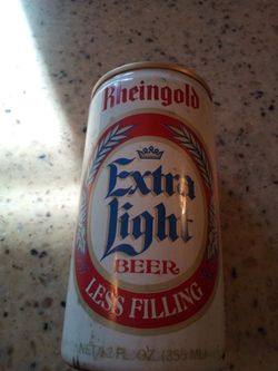 Vintage empty beer can/ rheingold extra light beer/ rheingold breweries,inc.- orange,new jersey