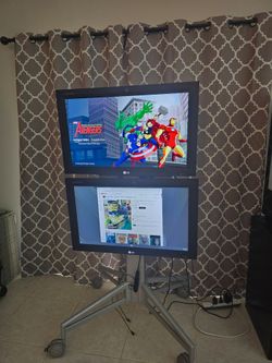 Qty. 2 - 32 Inch LG monitors Model M3203CCBA. With LG Smart Remote.  Portrait Or Landscape Display