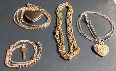 Lot of four gold tone necklaces