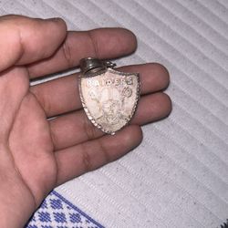 real raiders silver pendantt