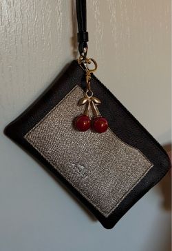 Coach Wristlet Wallet in dark brown, black, and metalic