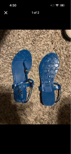 Coach’s bright teal blue New Jelly Sandals, with embossed signature logo design gold hardware sz 7