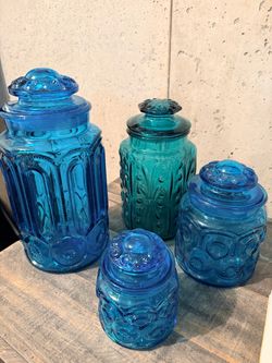 Set of 4 Blue Pressed Glass Lidded Canisters