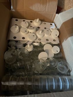 Box full of tea lights and crystal settings
