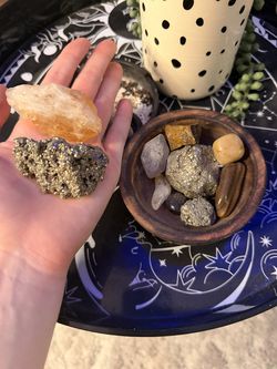 wooden bowl of assorted crystals