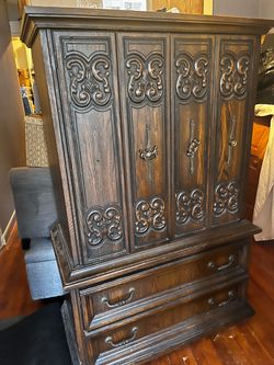 Dark Wood Armoire with Carved Detail