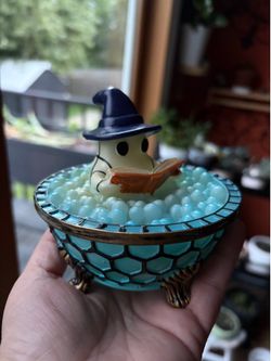 Little ghost reading in a bathtub that lights up. NEW.