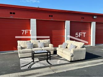 Beige sofa and loveseat